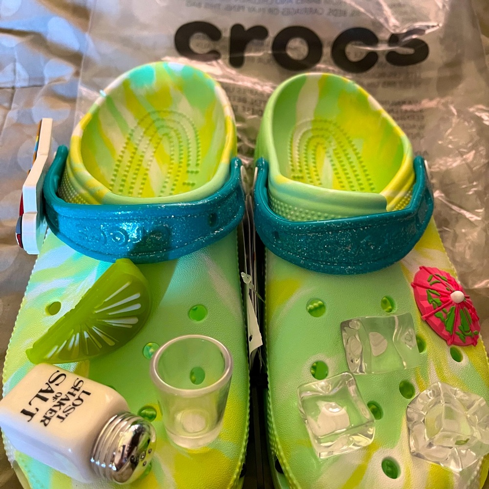 These are original Margaritaville crocs by Crocs. Never worn ,still in bag.